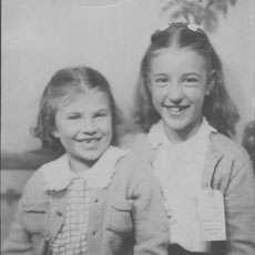 Betty Nelson at age 6 posing with a friend