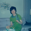 Betty Nelson with birthday cake, 1960s