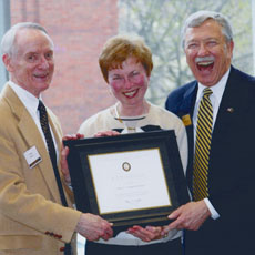 Purdue President Martain Jischke presents Betty and Dick Nelson with R.B. Stewart Society plaque