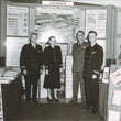 Beverley Stone with men in uniform
